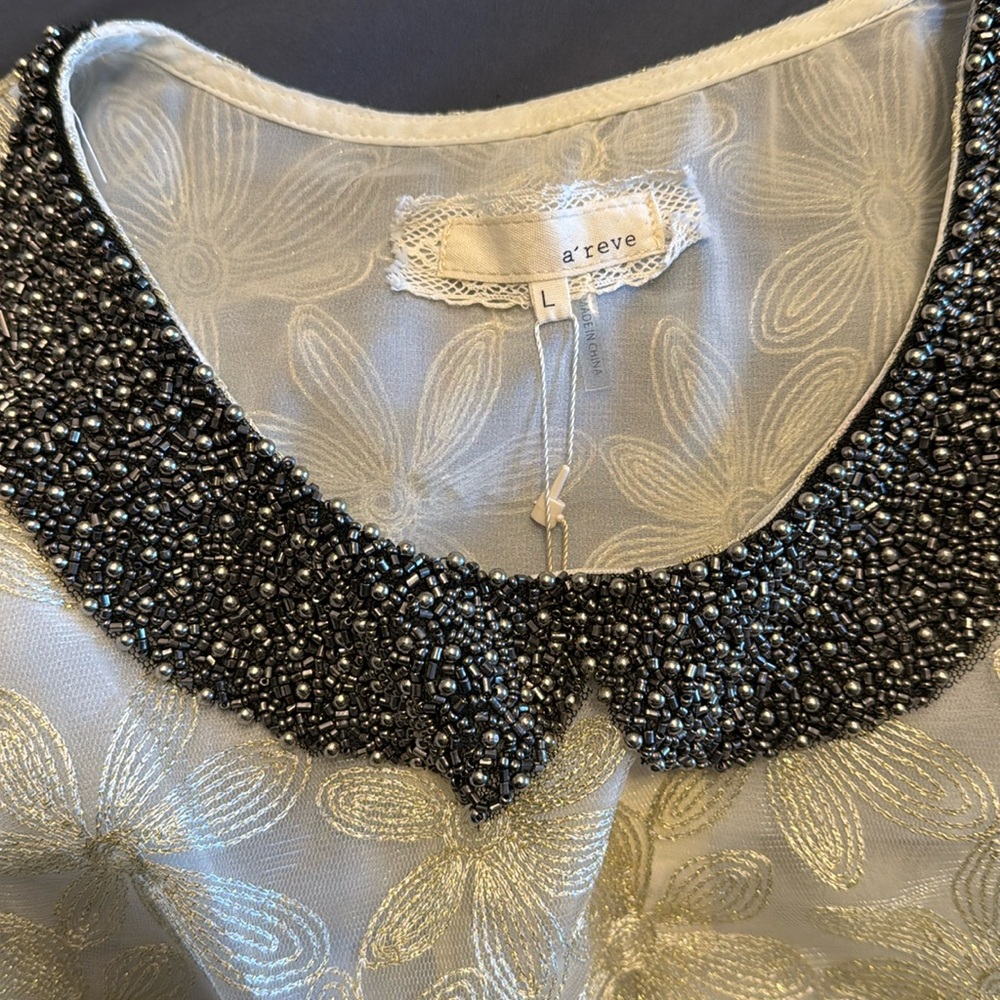 Beautiful detailed sleeveless top with beaded collar by A’Reve